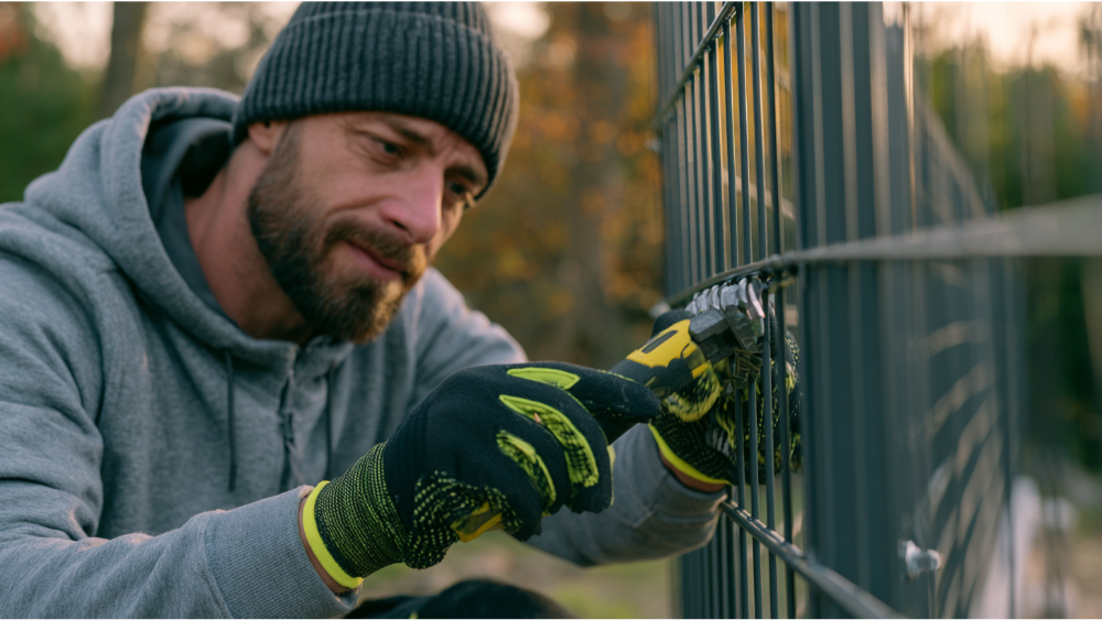 How Do Installers Secure Metal Fence Panels to Posts?